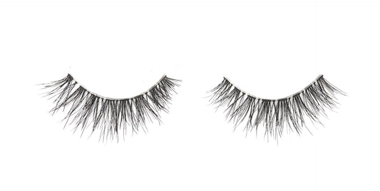 A single pair of Ardell Naked Lashes 425 featuring its multi-layered & short layered lashes isolated in white color setting