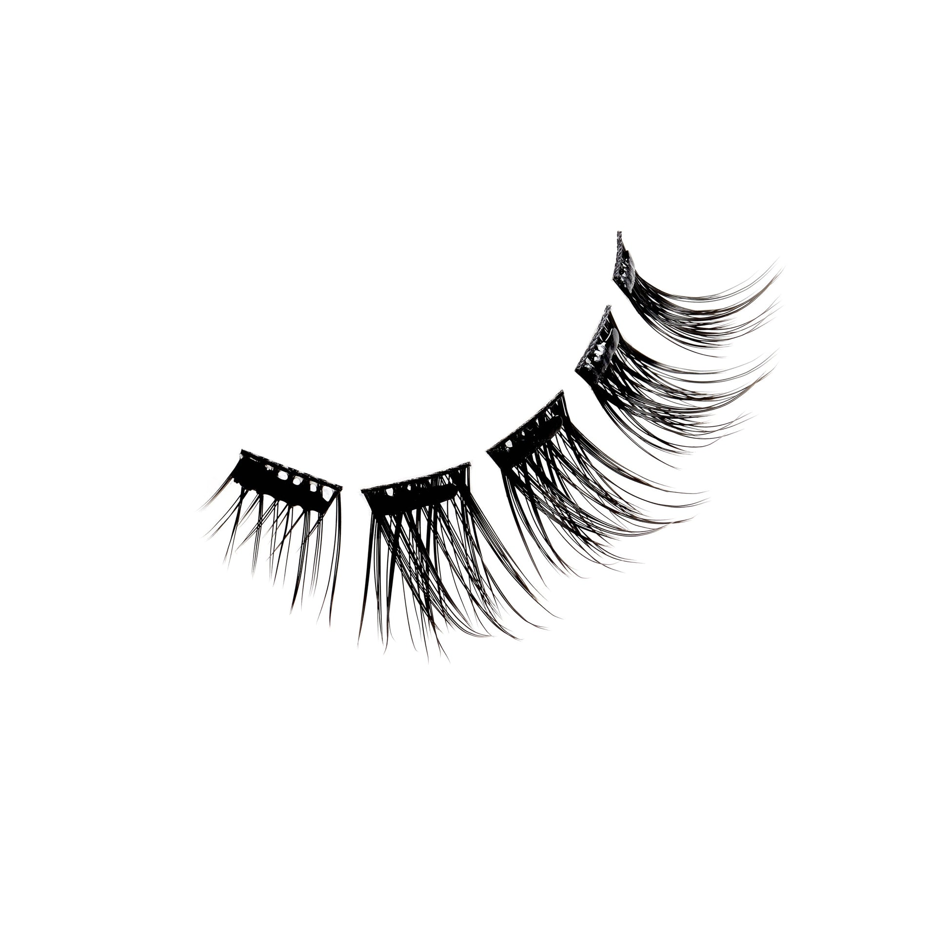 Floating set of Ardell Press-On Wispies Natural Lashes on a white background